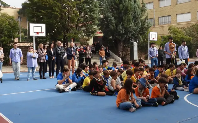 Jóvenes y responsables del Grupo Scout Católico San Juan Bosco de Puertollano durante el acto de inicio de curso